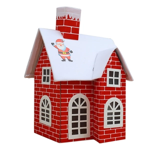 Christmas gift house model with red brick pattern and snowy roof for holiday decoration