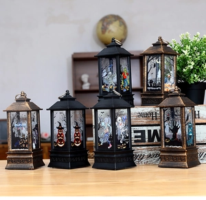 Close-up of Halloween LED lanterns with vintage finish and festive pumpkin illustrations