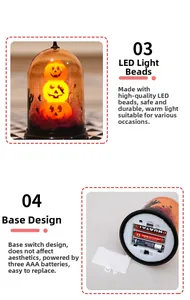 Detailed view of Halloween pumpkin LED lamp base with battery compartment and switch
