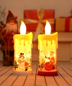 Detailansicht der LED-Weihnachtskerzen mit gemaltem Weihnachtsmann und Schneemann-Motiv