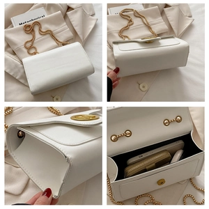 Interior view of white quilted crossbody bag showing storage for phone and wallet