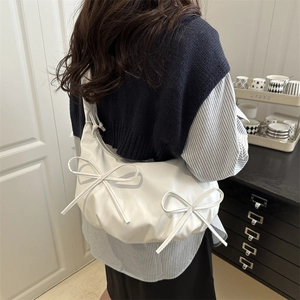 White puffy hobo bag with bow detail and ruched design for stylish women shoulder wear