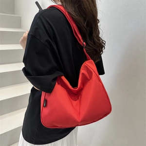 2025 casual red canvas crossbody bag with large capacity and crescent shape for women