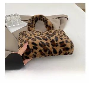 Detail shot of the soft leopard print faux fur texture on this stylish plush handbag