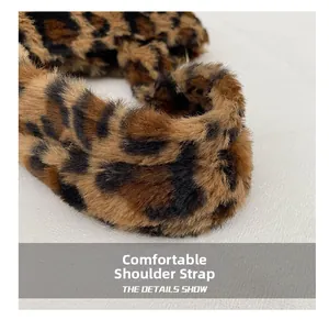Detail view of the soft leopard print plush shoulder strap with fluffy texture