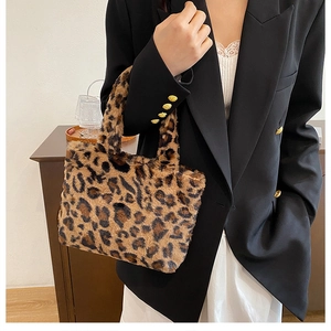 Detail of the soft leopard print faux fur tote bag with plush handles and texture