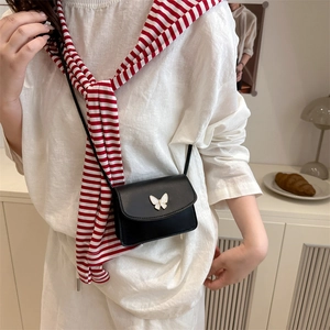 Mini black PU leather crossbody bag with a white bow metal buckle and simple style