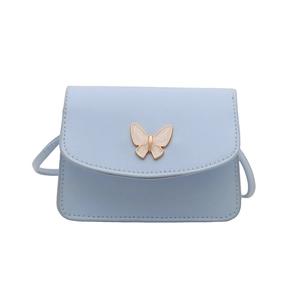 Light blue faux leather mini crossbody bag with a cream butterfly buckle on white background