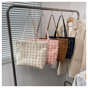 Detailed display of vintage patterned tote bags in white, pink, brown, and black colors
