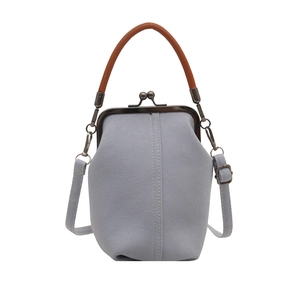 Vintage light blue denim crossbody bag with metal kiss lock and brown leather handle