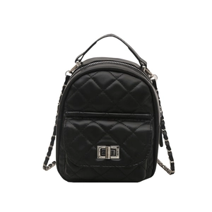 Chic black quilted mini backpack with silver metal twist lock and chain strap