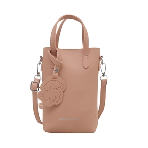 Minimalist pink faux leather crossbody phone bag with dog charm and slim shoulder strap