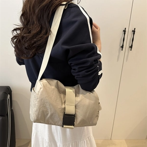 Minimalist beige nylon tote crossbody bag with buckle closure for casual daily use
