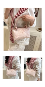 Detail of pink lace bucket bag with exquisite butterfly embroidery and dual handles