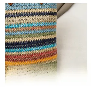 Macro shot of colorful striped straw texture and premium woven fabric on this stylish bag