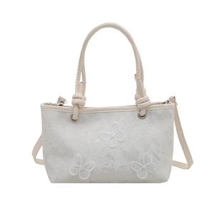 Sac seau blanc avec broderie papillon, doubles poignées et bandoulière réglable