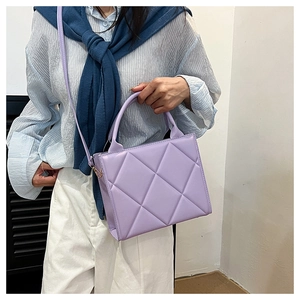 Lavender quilted tote bag featuring a structured square design and matching shoulder strap