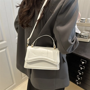 Elegant white square handbag with wavy edge flap and gold hardware for women