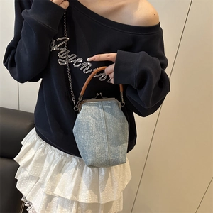 Retro denim doctor bag with blue glitter fabric, brown leather handle and metal chain