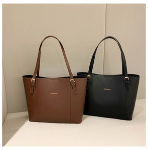 Detail of adjustable metal buckle and golden logo on fashion colorblock tote bags