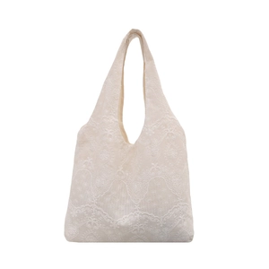 Minimalist white lace tote bag with floral crochet embroidery for summer beach vacation