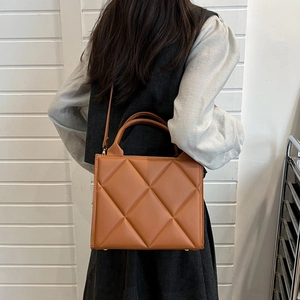 Large brown quilted tote bag for women with rhombus pattern and twin top handles