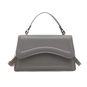 Elegant dark grey minimalist faux leather handbag with curved envelope flap and gold hardware