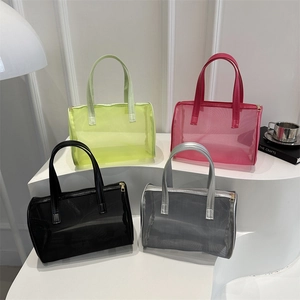 Portable mesh vanity bags in neon green, magenta, black, and silver grey with top handles