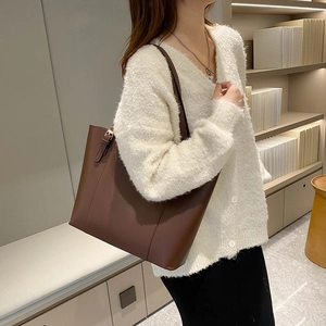 Classic dark brown leather tote bag for women with spacious minimalist design for work