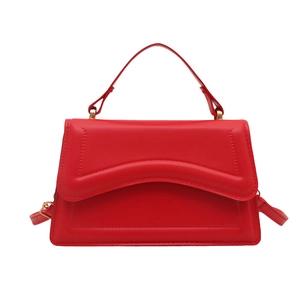 Red French style textured shoulder bag with unique wave pattern and gold hardware accents