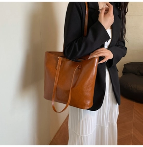 Brown faux leather tote bag with long straps for stylish everyday office use