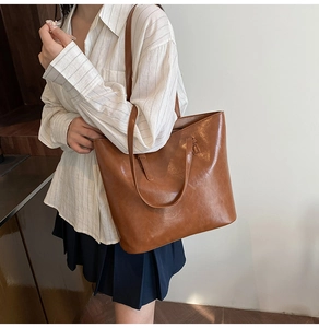Brown large capacity PU leather tote bag shown on model for daily commuting style