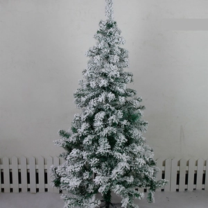 Detail of flocked Christmas tree with realistic white snow and durable metal stand