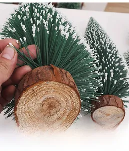 Close-up of mini flocked Christmas tree showing dense pine needles with snow effect