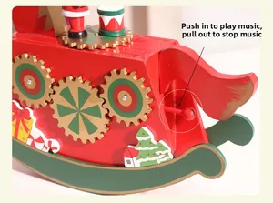 Detail of wooden Christmas rocking horse music box with red pull switch for music control