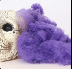 Macro shot of purple artificial spider web fiber texture for Halloween decorations