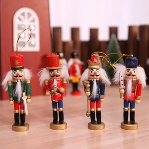 Set of four handmade wooden nutcracker soldier puppets for Christmas tree decorations