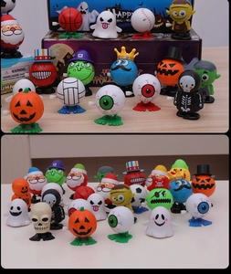 Macro view of assorted clockwork toys featuring pumpkins and sports ball designs