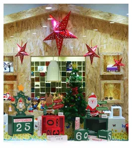 Close-up of wooden Christmas countdown calendar with Santa, reindeer and star details