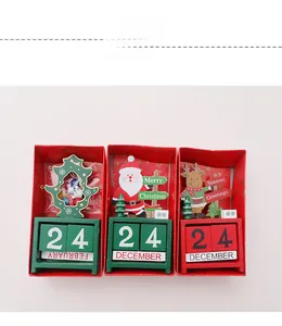 Detailed view of three wooden Christmas countdown calendars with gift box packaging