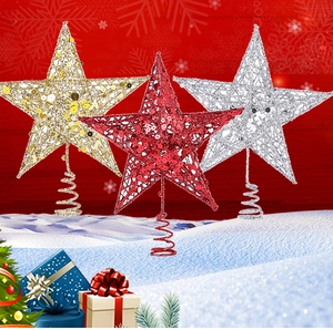 Detailed view of glittery gold, red, and silver star toppers with spiral bases for trees