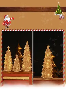 Close-up of golden iron mesh Christmas tree with warm LED lights and star topper