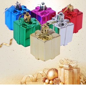 Close-up of metallic Christmas gift box ornaments in six glossy festive colors