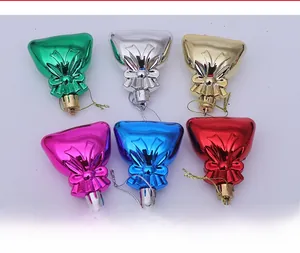 Detail of colorful electroplated Christmas gift bag pendants with ribbon bows for tree decor