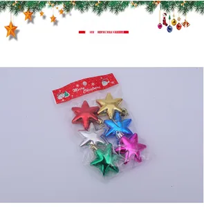 Detailed view of colorful metallic star-shaped Christmas tree ornaments in packaging
