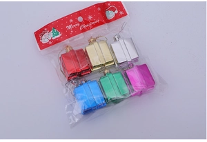 Close-up of colorful assorted Christmas gift box ornaments with shiny metallic finish