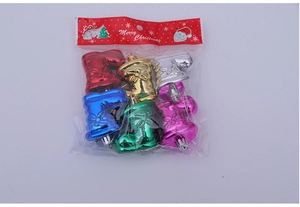 Close-up of colorful Christmas tree ornaments in various shiny metallic finishes
