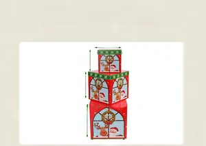 Detailed view of stacked red and green Christmas gift boxes with Santa and reindeer patterns