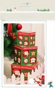 Close-up of three Christmas gift boxes with Santa and reindeer illustrations for decor