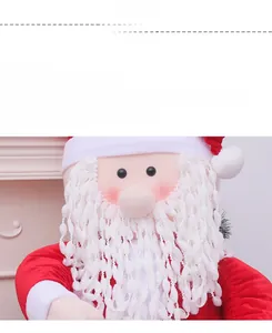 Close-up of a Christmas Santa Claus plush doll featuring red fabric and white knitted beard